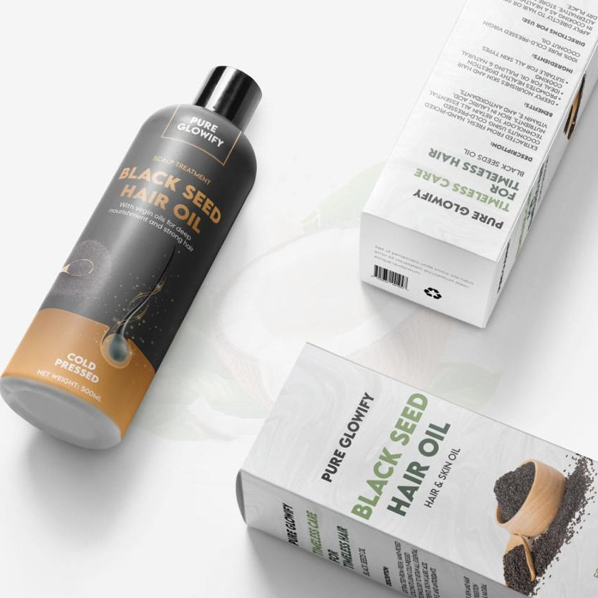 Black Seed Hair Oil bottle and packaging on a white background
