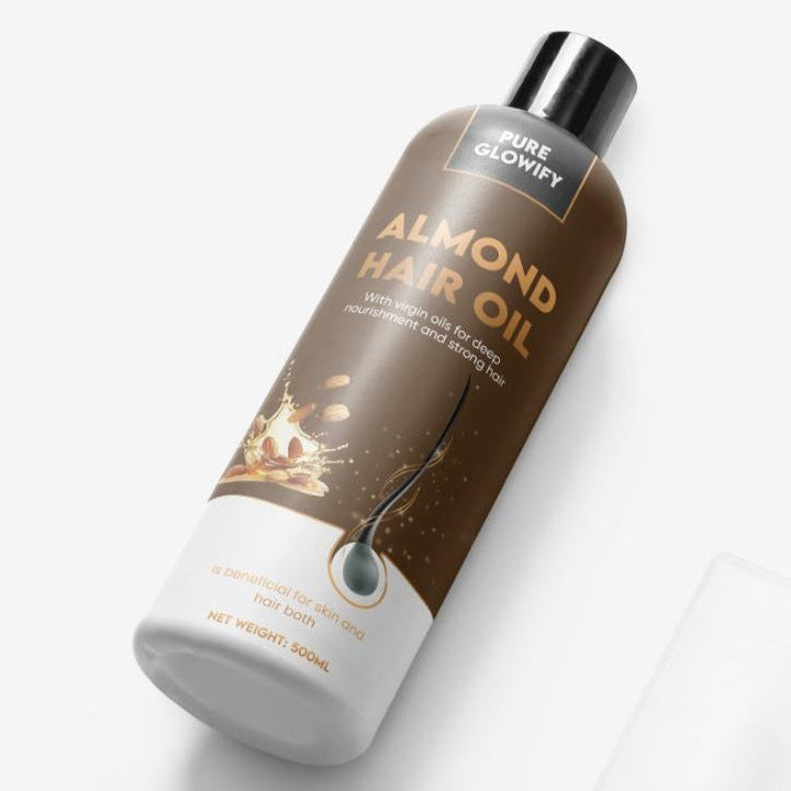 Almond hair oil bottle on a white background